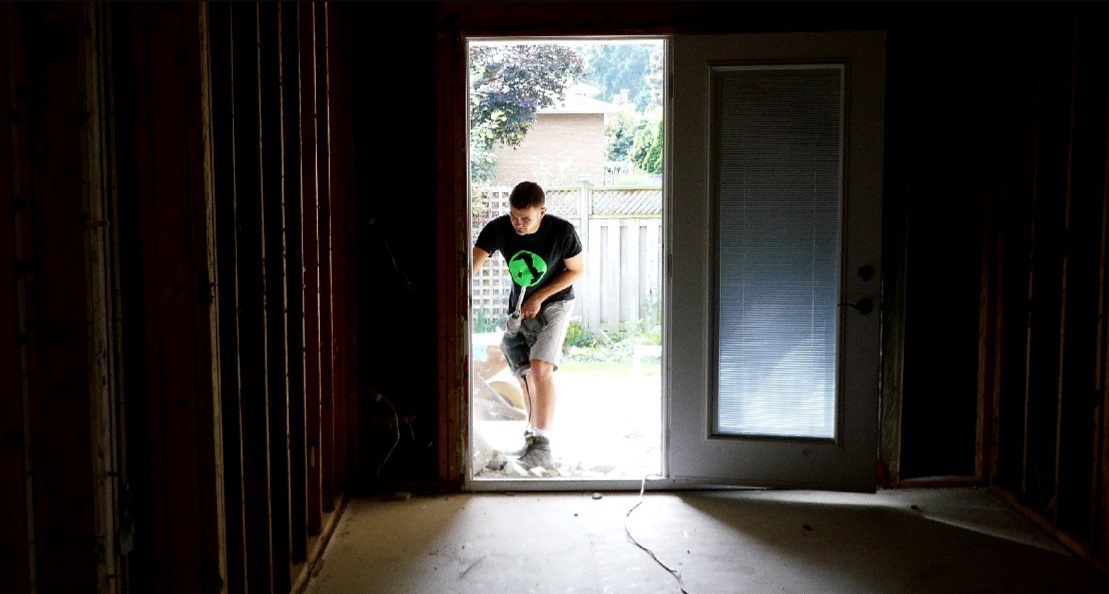 small business owner in open doorway